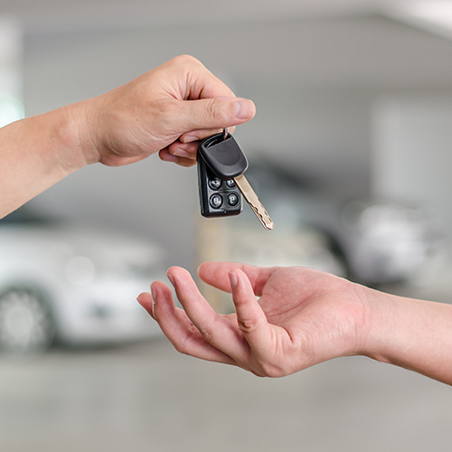 hand holding a car key